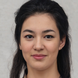 Joyful asian young-adult female with long  brown hair and brown eyes