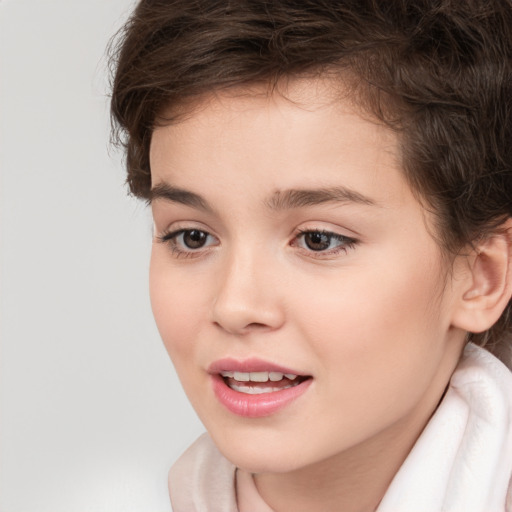 Joyful white child female with short  brown hair and brown eyes