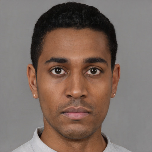 Neutral black young-adult male with short  black hair and brown eyes