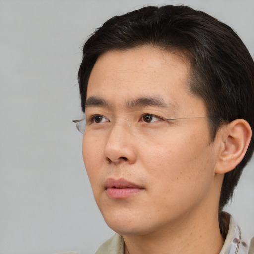 Neutral asian young-adult male with short  brown hair and brown eyes