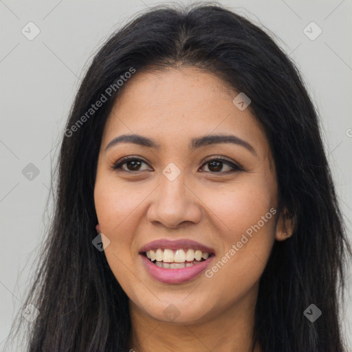 Joyful latino young-adult female with long  brown hair and brown eyes