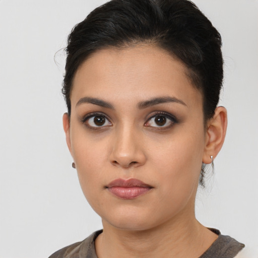 Neutral white young-adult female with short  brown hair and brown eyes