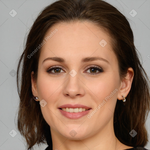 Joyful white young-adult female with long  brown hair and green eyes