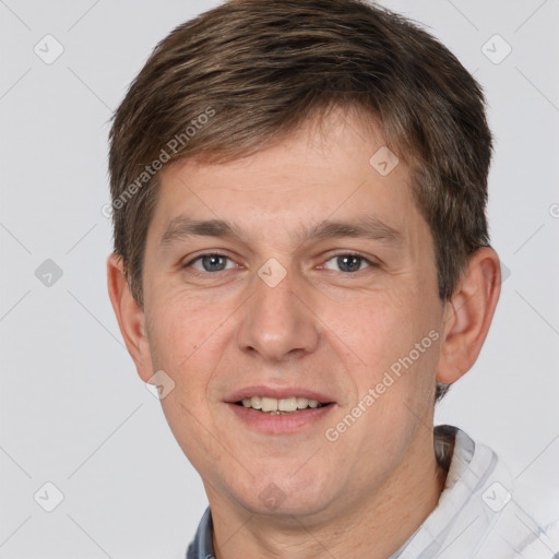 Joyful white adult male with short  brown hair and brown eyes