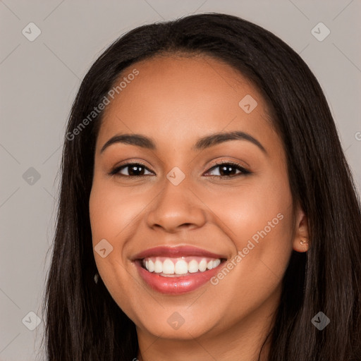 Joyful latino young-adult female with long  black hair and brown eyes