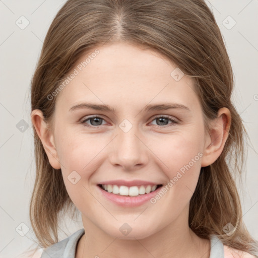 Joyful white young-adult female with medium  brown hair and grey eyes