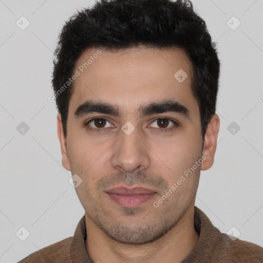 Joyful white young-adult male with short  black hair and brown eyes