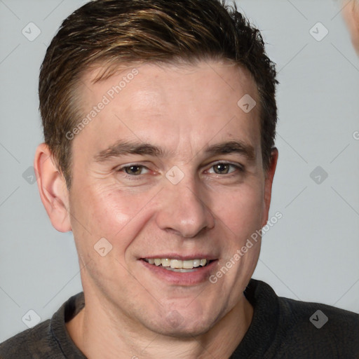 Joyful white adult male with short  brown hair and grey eyes