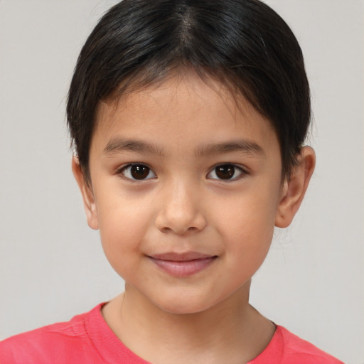 Joyful white child female with short  brown hair and brown eyes