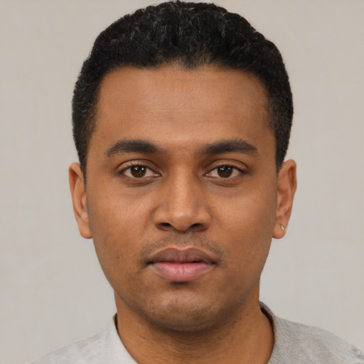 Neutral latino young-adult male with short  black hair and brown eyes