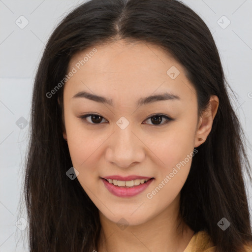 Joyful asian young-adult female with long  brown hair and brown eyes