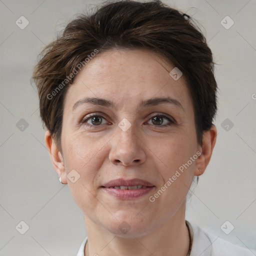 Joyful white adult female with short  brown hair and brown eyes