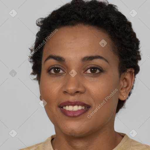 Joyful black young-adult female with short  brown hair and brown eyes