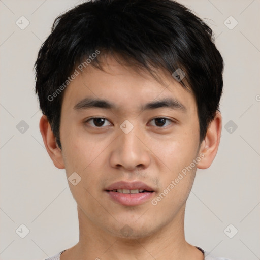 Joyful asian young-adult male with short  brown hair and brown eyes