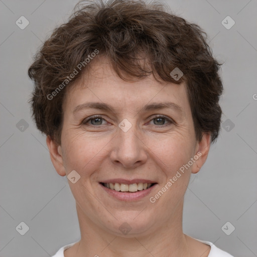 Joyful white adult female with short  brown hair and brown eyes