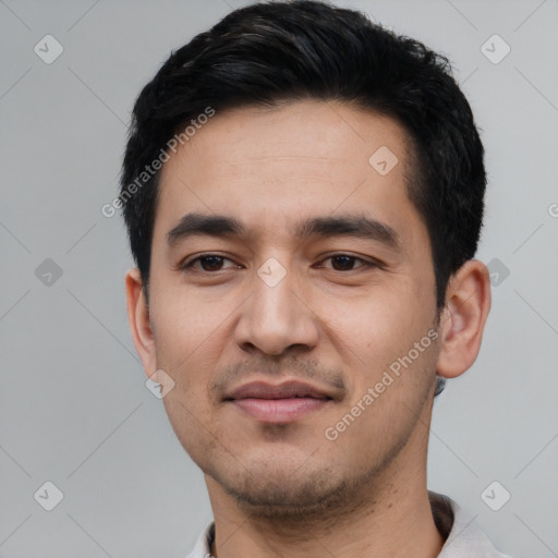 Joyful asian young-adult male with short  black hair and brown eyes