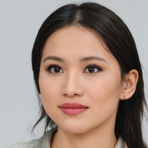 Joyful latino young-adult female with medium  black hair and brown eyes
