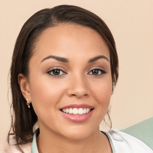 Joyful white young-adult female with medium  brown hair and brown eyes