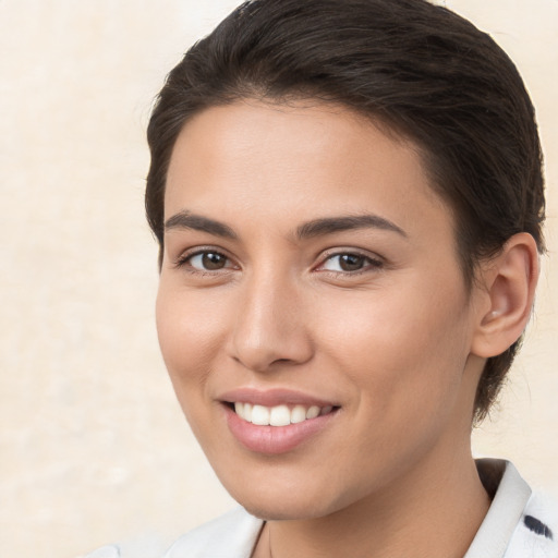 Joyful white young-adult female with medium  brown hair and brown eyes