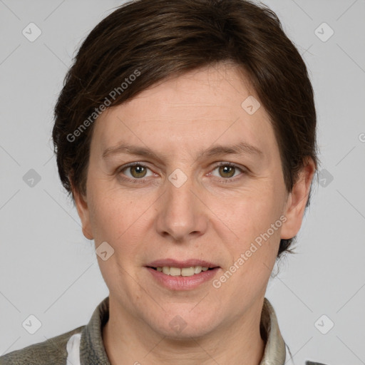 Joyful white adult female with short  brown hair and grey eyes