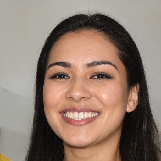 Joyful white young-adult female with long  black hair and brown eyes