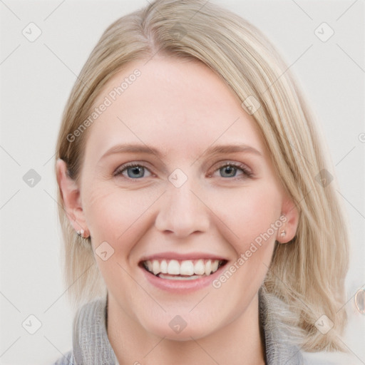 Joyful white young-adult female with medium  brown hair and blue eyes