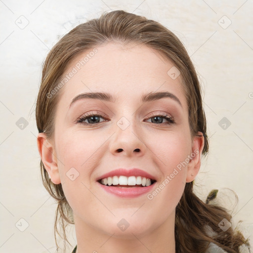 Joyful white young-adult female with medium  brown hair and blue eyes