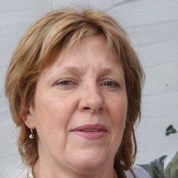 Joyful white adult female with medium  brown hair and blue eyes