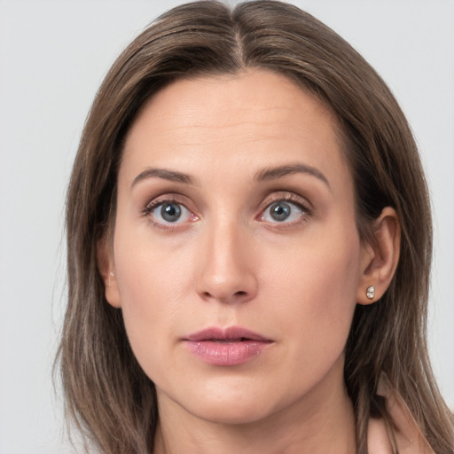 Neutral white young-adult female with long  brown hair and grey eyes