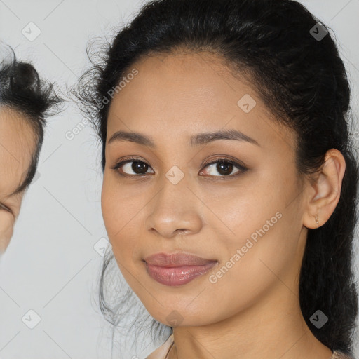 Joyful latino young-adult female with medium  brown hair and brown eyes