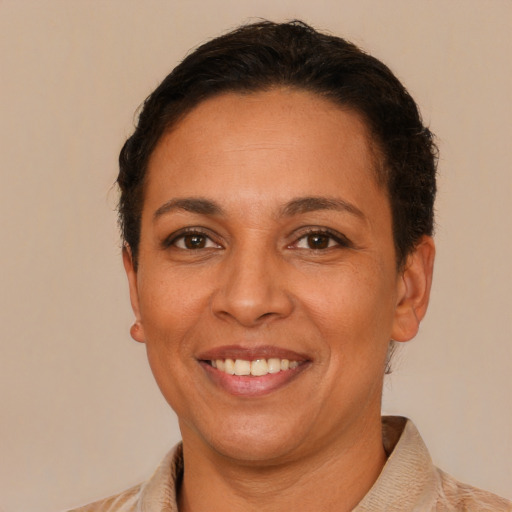 Joyful latino young-adult female with short  brown hair and brown eyes