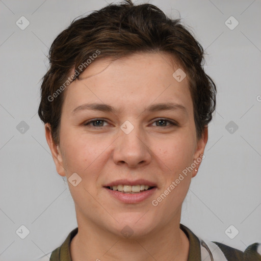 Joyful white young-adult female with short  brown hair and grey eyes