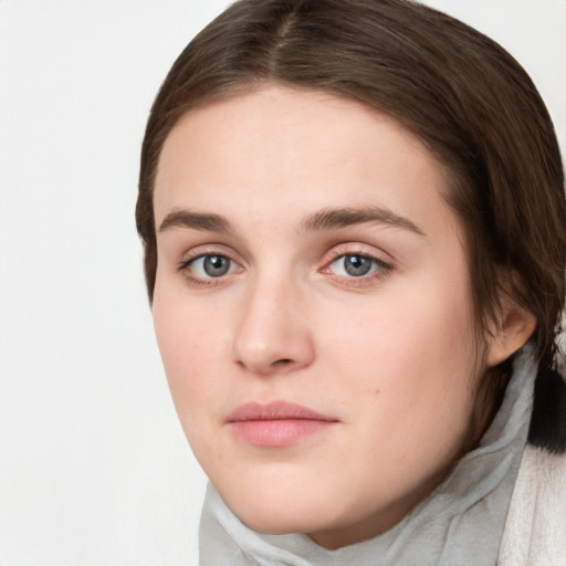 Neutral white young-adult female with medium  brown hair and green eyes