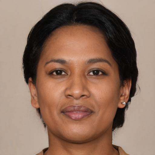 Joyful asian adult female with medium  black hair and brown eyes