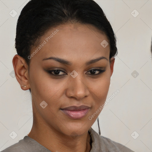 Joyful black young-adult female with short  brown hair and brown eyes