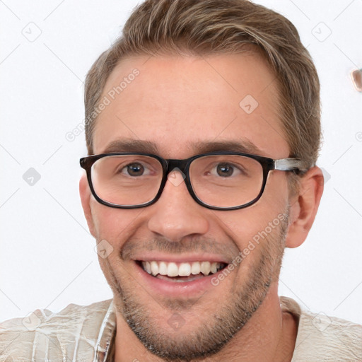 Joyful white young-adult male with short  brown hair and brown eyes