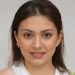 Joyful white young-adult female with medium  brown hair and brown eyes