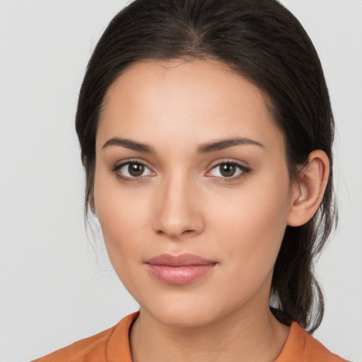 Joyful white young-adult female with medium  brown hair and brown eyes