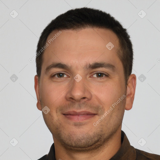 Joyful white young-adult male with short  black hair and brown eyes