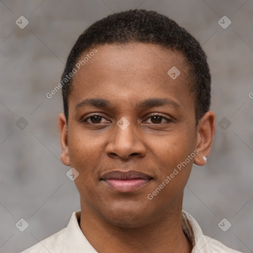 Joyful latino young-adult male with short  brown hair and brown eyes