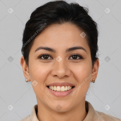 Joyful latino young-adult female with short  brown hair and brown eyes