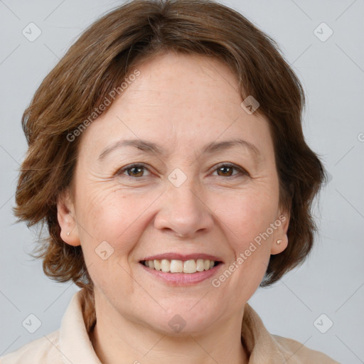 Joyful white adult female with medium  brown hair and grey eyes