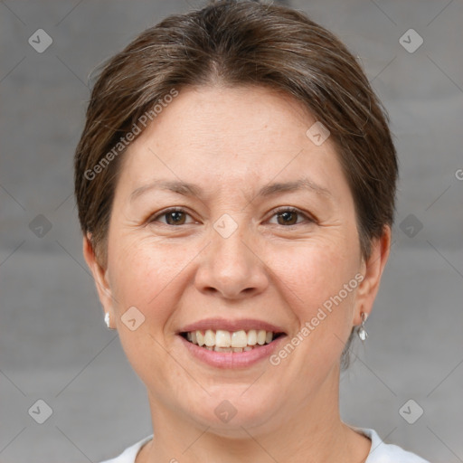 Joyful white adult female with short  brown hair and brown eyes