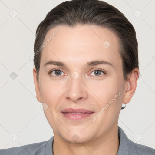 Joyful white adult female with short  brown hair and brown eyes