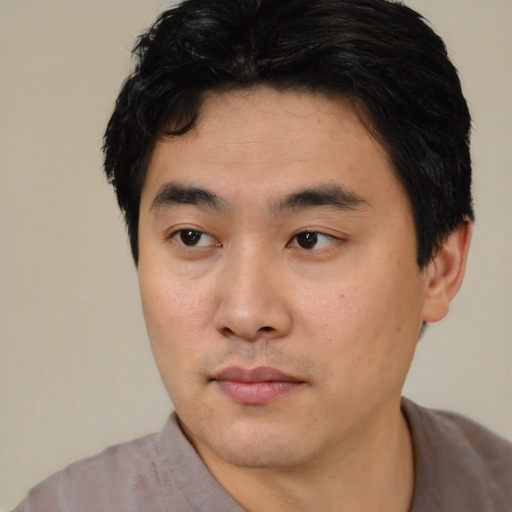 Neutral asian young-adult male with short  black hair and brown eyes