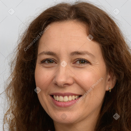 Joyful white adult female with long  brown hair and brown eyes