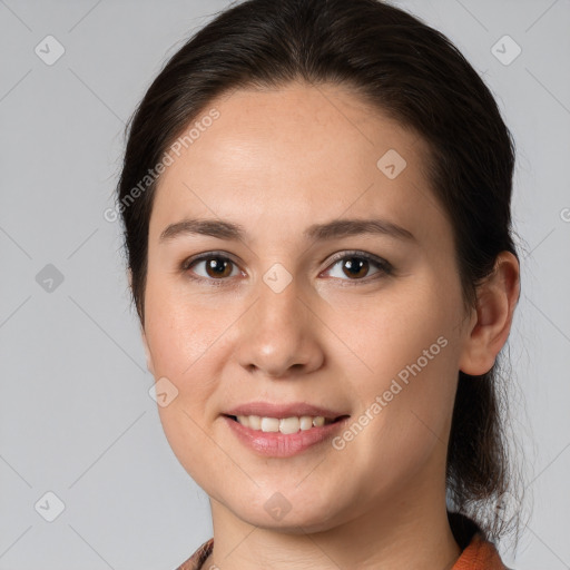 Joyful white young-adult female with medium  brown hair and brown eyes