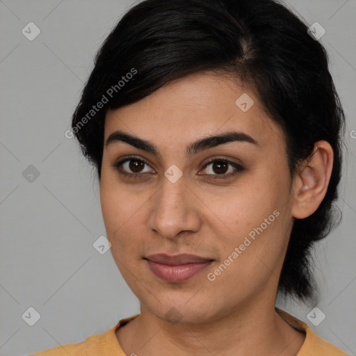 Joyful latino young-adult female with medium  brown hair and brown eyes