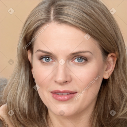 Joyful white adult female with long  brown hair and grey eyes