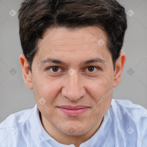 Joyful white adult male with short  brown hair and brown eyes